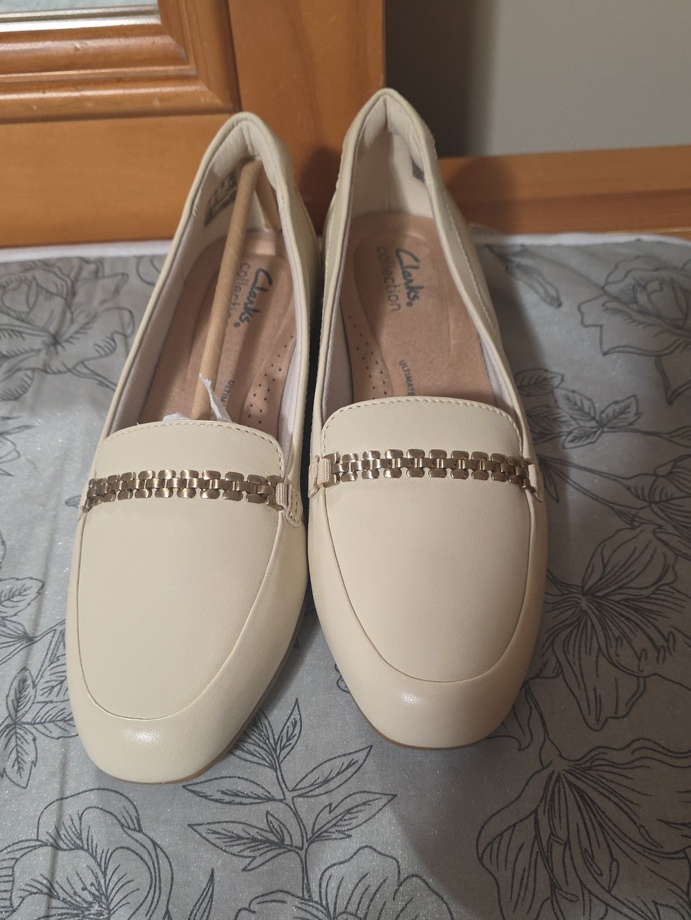 Clarks Cream Loafers with Gold Chain Trim